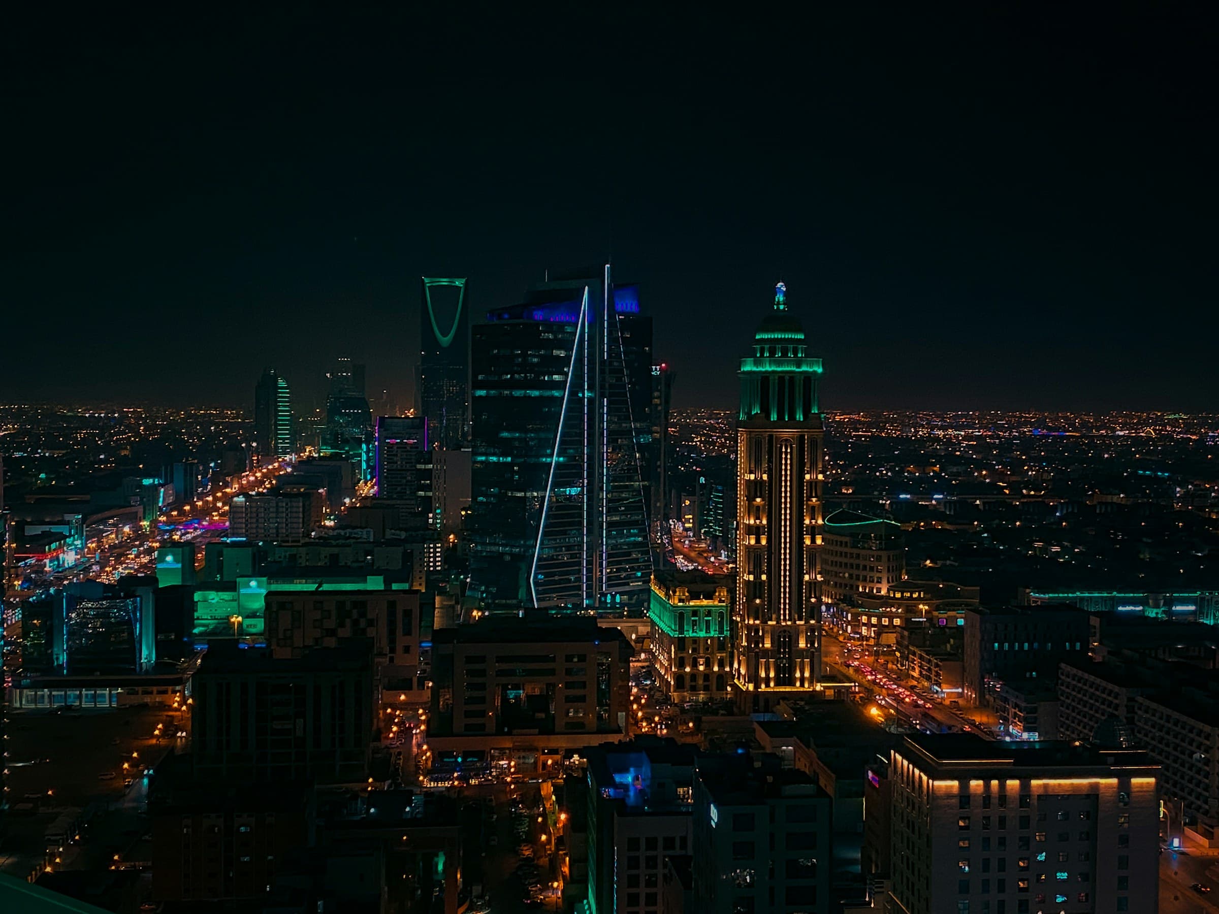 The Riyadh skyline at night, with the Kingdom Centre and Al Faisaliah towers